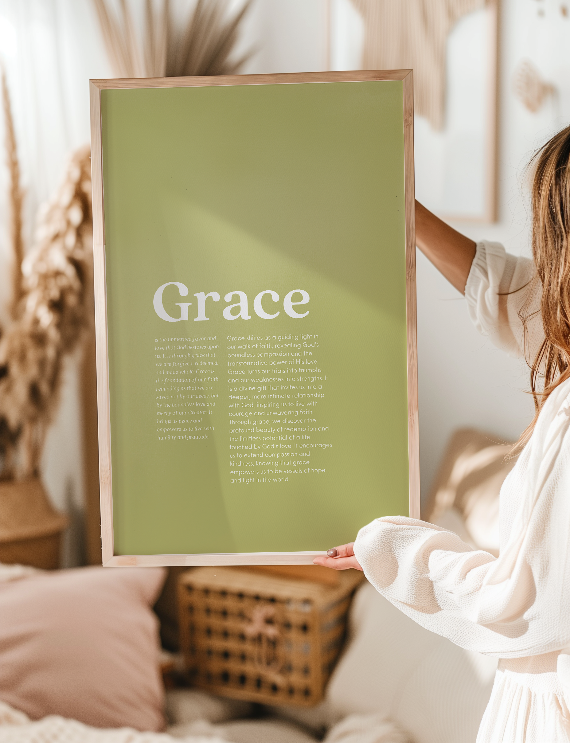 Person holding a framed Grace Christian wall art poster featuring an inspirational message about grace faith-based motivational artwork for boho-style bedrooms or living spaces