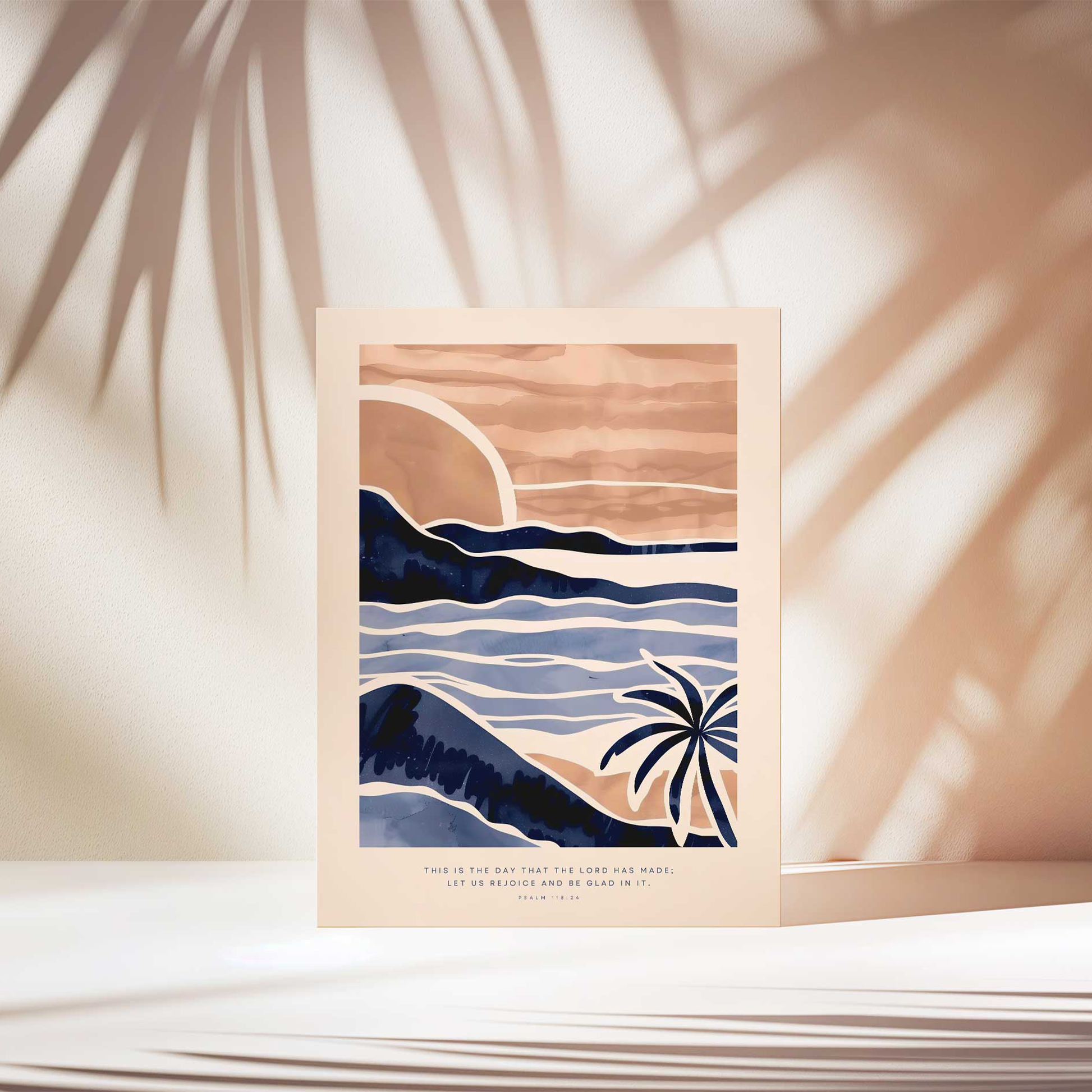 Psalm 118:24 poster print depicting a sunset over mountains and waves with a palm tree, bathed in soft natural light casting palm shadows. Ideal for faith-based home decor or an inspirational gift.