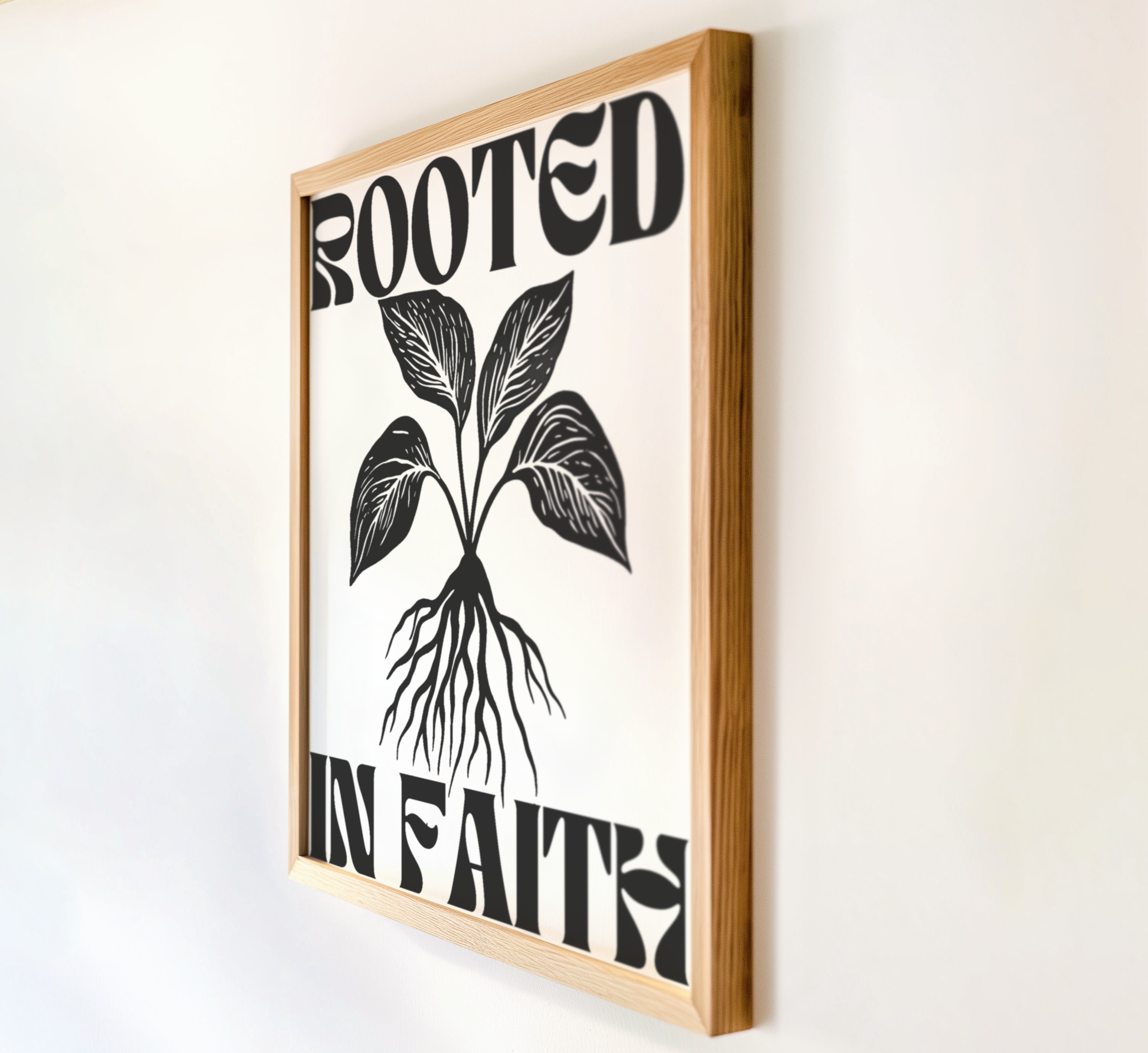 Side view of Rooted in Faith Christian wall art print in wooden frame with modern minimalist botanical design roots and leaves faith-based home decor.