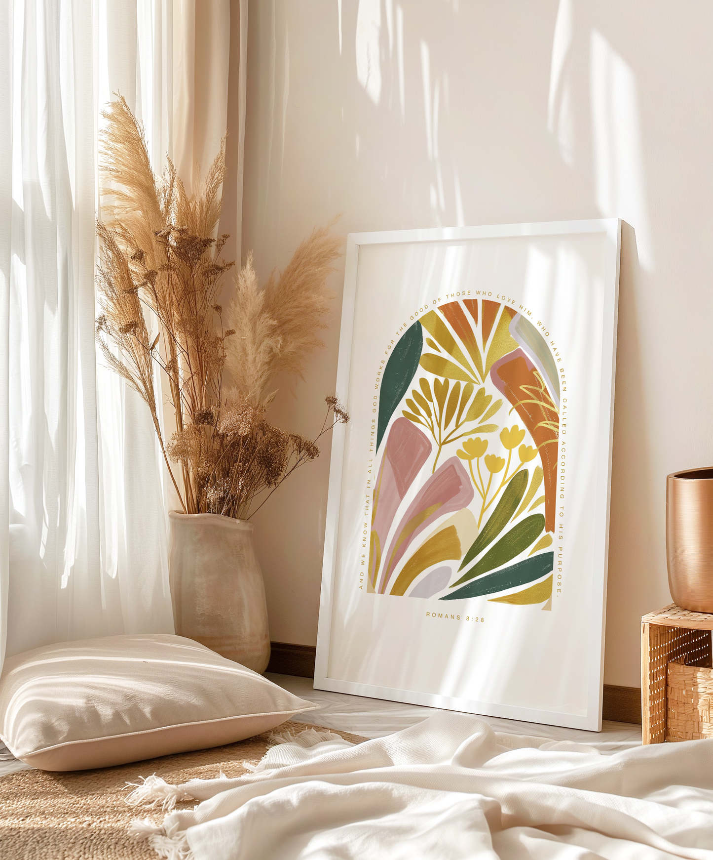 Botanical-inspired wall art featuring Romans 8:28, beautifully framed and leaning against a sunlit wall. This minimalist design brings warmth and nature into your space, ideal for boho home decor and adding a peaceful, reflective touch to any room.